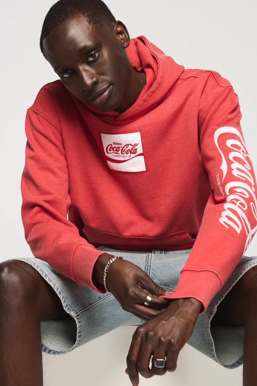 Image of Lucky Brand Coca-Cola Logo Hoodie - Men's Clothing Outerwear Sweatshirts Crewneck Hoodies in Fiery Red