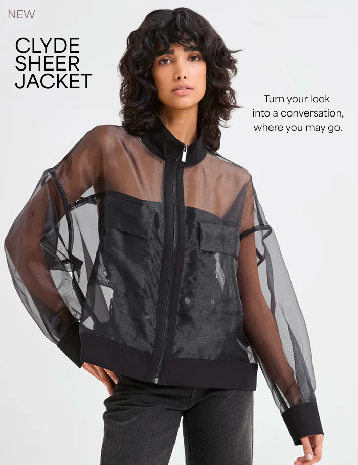 Emma wears The Clyde Sheer Jacket over a black top and jeans, captioned “Clyde Sheer Jacket - Turn your look  into a conversation, where you may go."