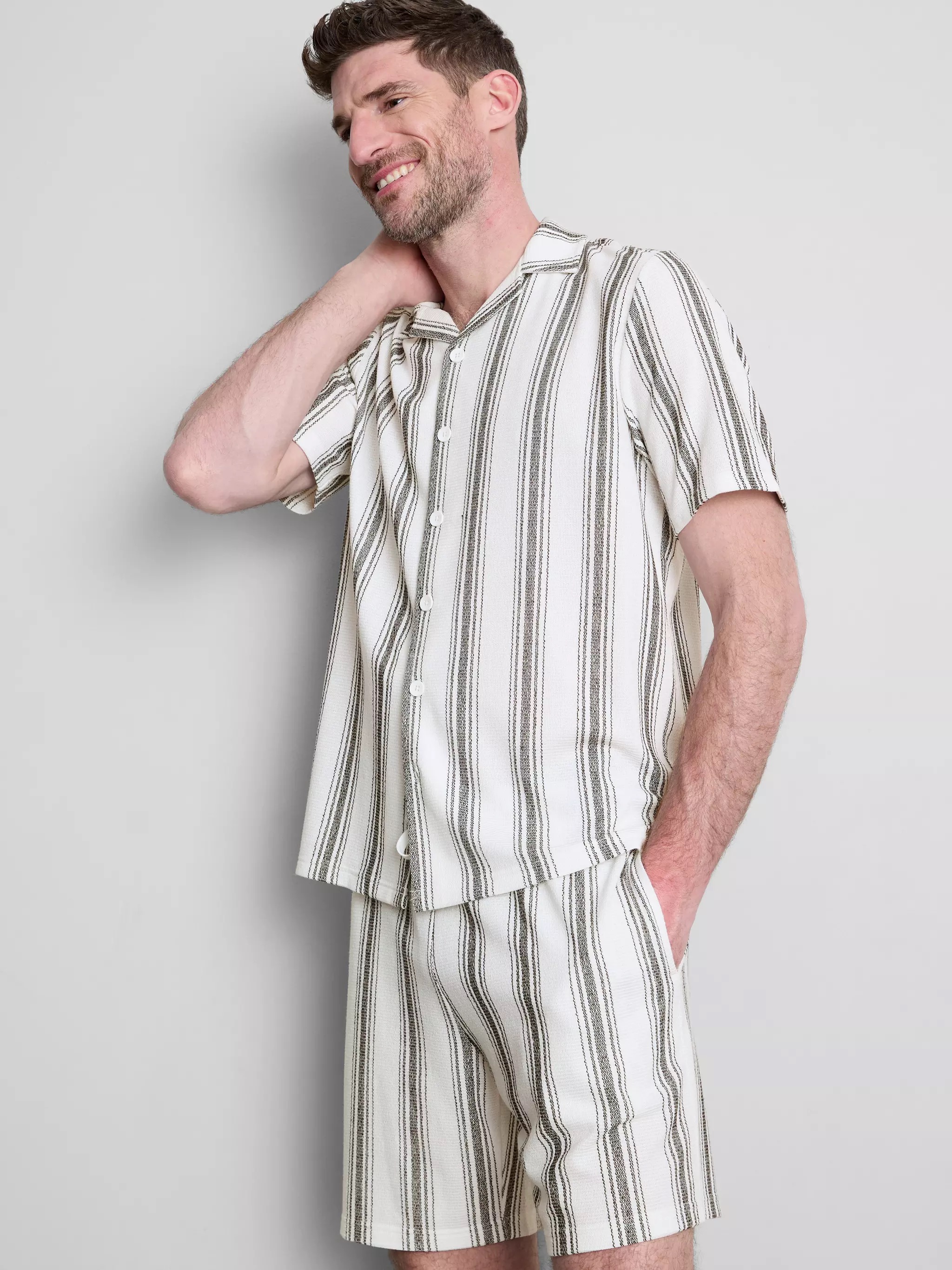 Man wearing a Striped Pajama Shirt