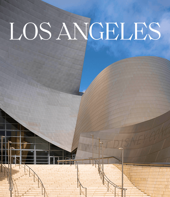 Modern curved architectural building with steps and blue sky, overlaid with 'LOS ANGELES'.
