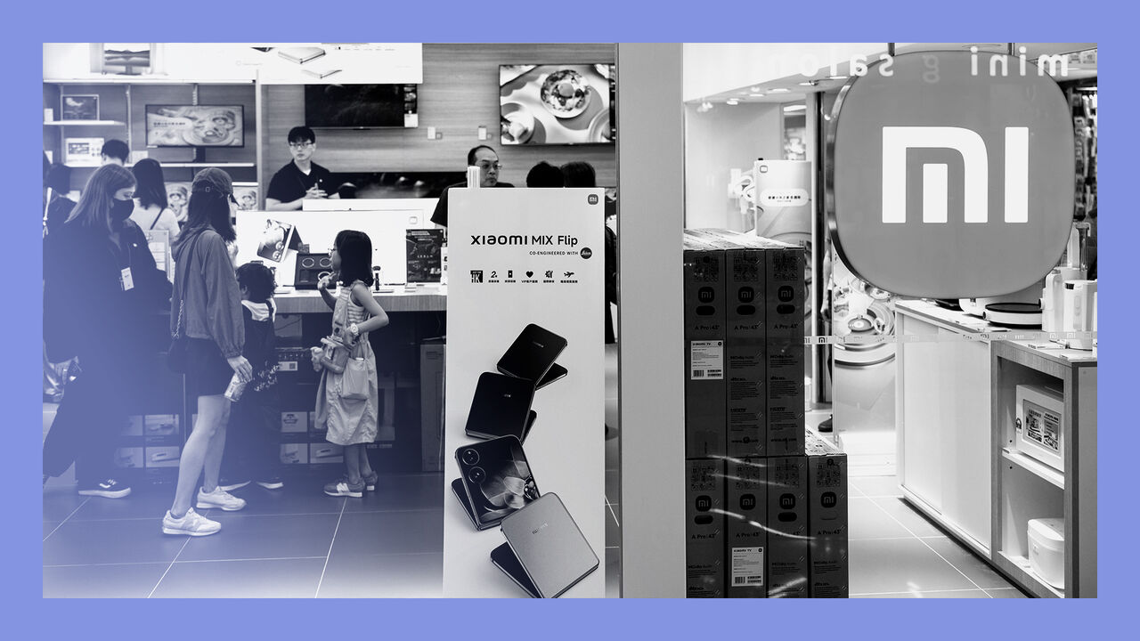 Customers are seen at the Chinese multinational technology and electronics brand Xiaomi flagship store in Hong Kong.