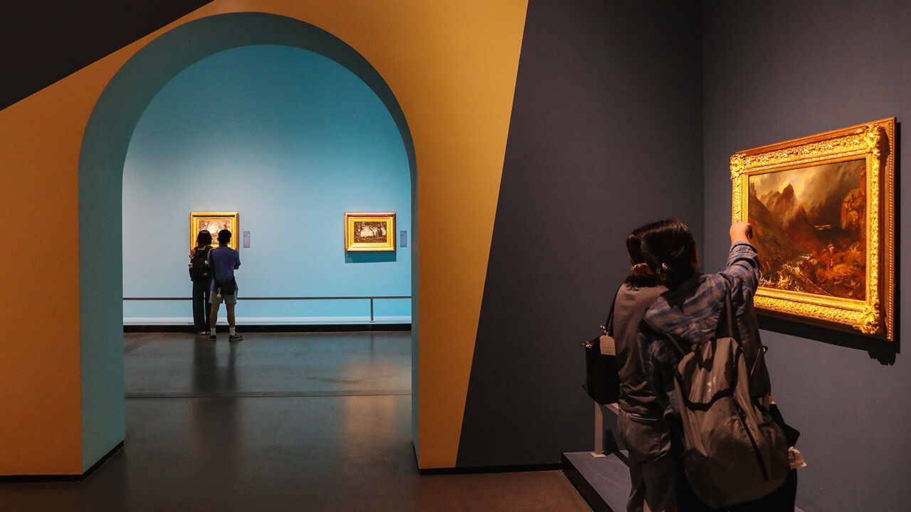 Visitors view paintings at the exhibition entitled From Corot to Impressionism: A Flowing Platette at Hubei Provincial Museum in China.