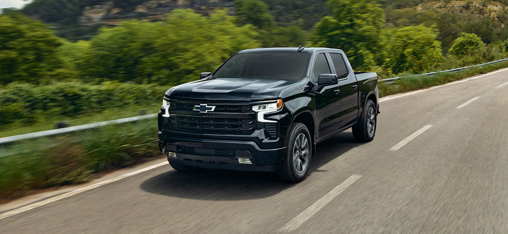Silverado 1500 RST driving down a highway.