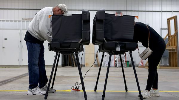 Voters place their votes in the Indian primary election