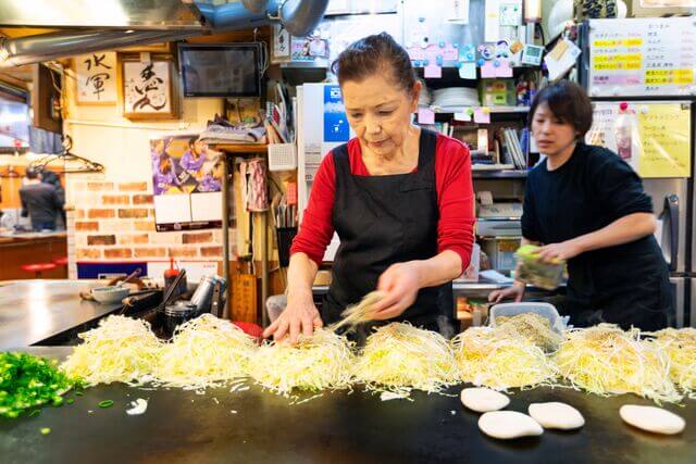 Hiroshima woman making Okonomiyaki