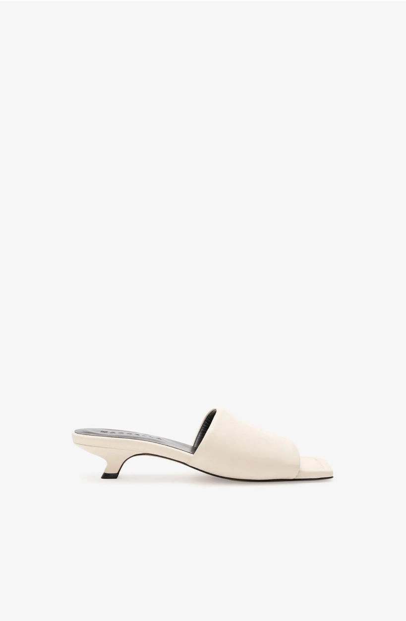 Side profile of The Sunset Sandals with a low kitten heel, shown on a white background.