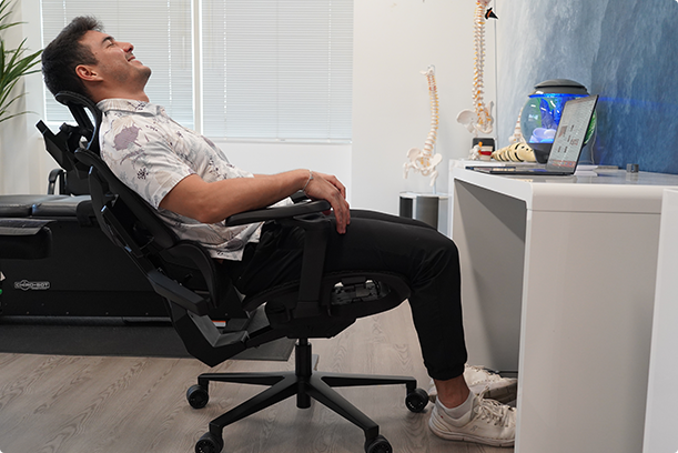 A man sitting in X-air mesh chair smiling