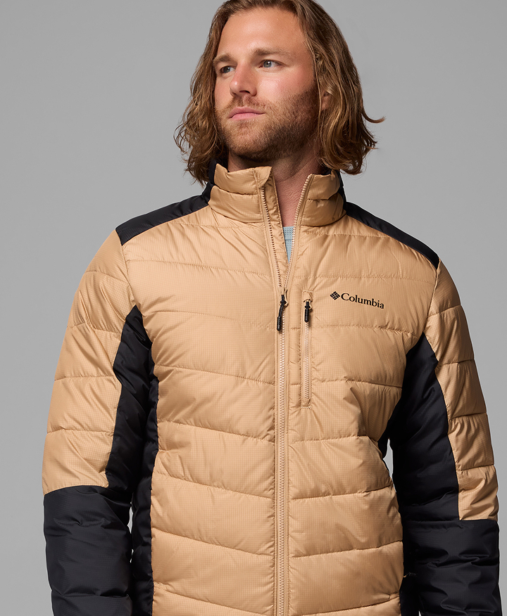 A man wearing a tan winter jacket.