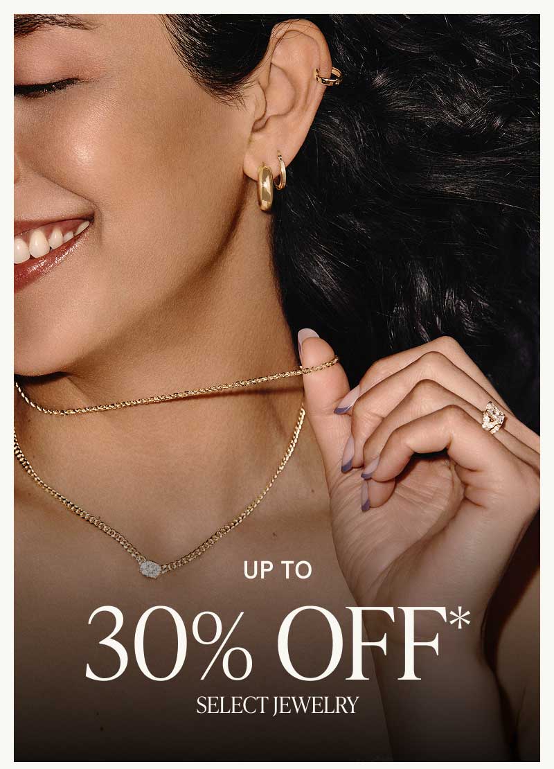 Model wearing gold huggies, rings & chains with diamond pendant.  Up to 30% OFF Select Jewelry.