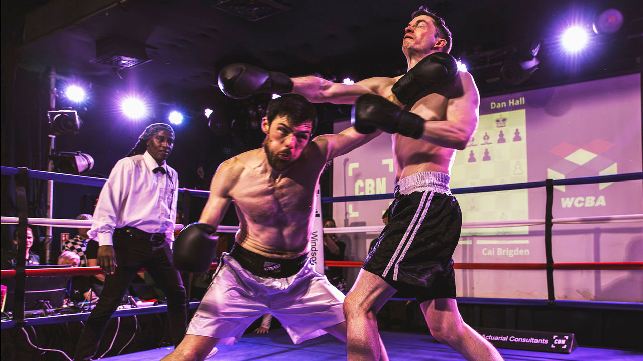 Contestants have a round of boxing. 