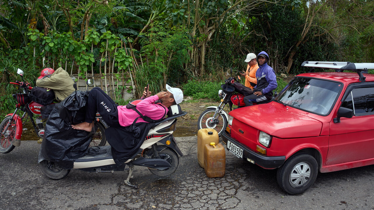 Drivers wait in a long line to enter a gas station in Bacuranao near Havana, Cuba.