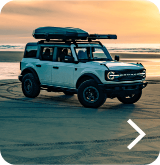 A Bronco&reg; SUV Badlands&reg; model parked on a beach