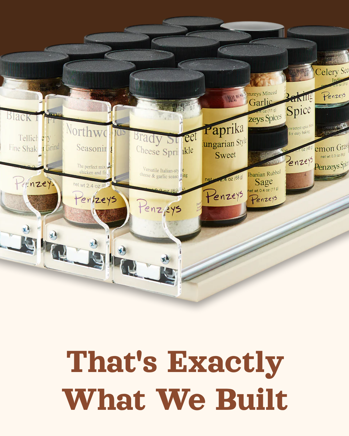 Close-up of spice rack drawer with labeled spice jars organized in a smooth-glide pull-out system