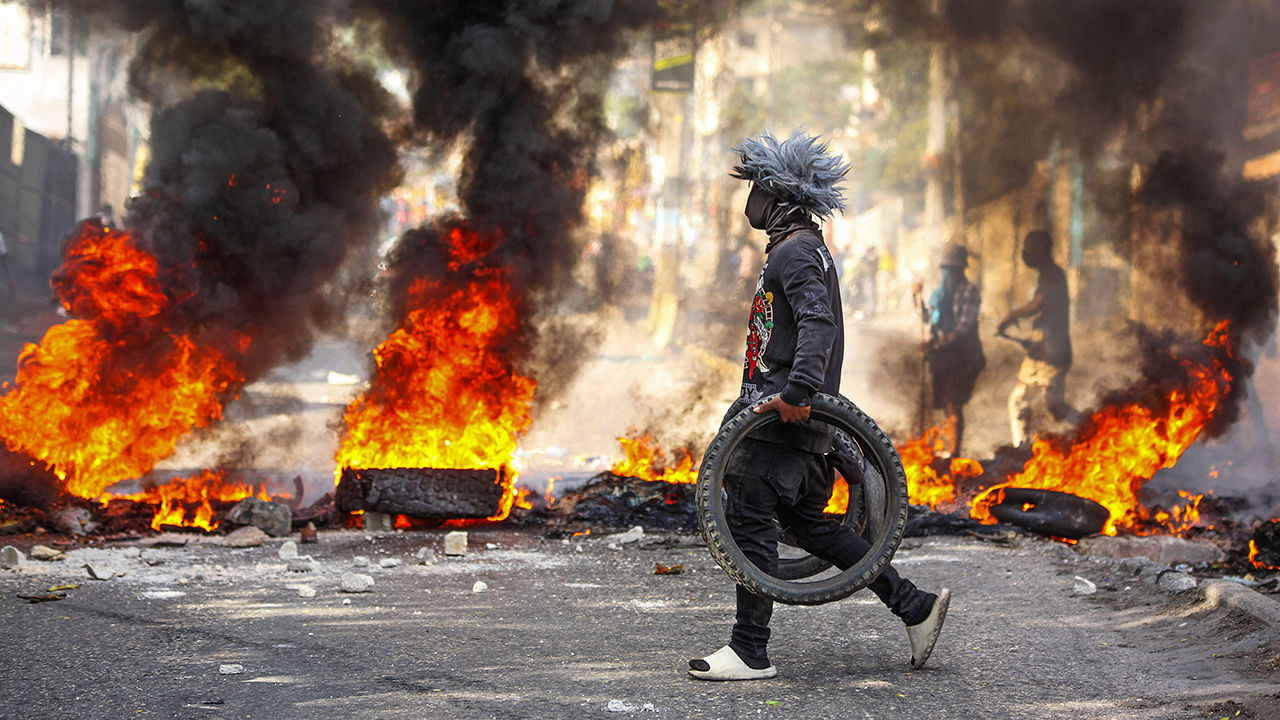 housands of protesters in Haiti's capital have clashed with police as they denounce a surge in gang violence
