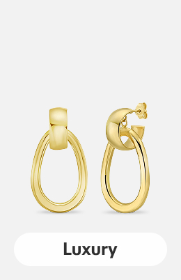 14K yellow gold interlocking drop hoop earrings on a light gray tile.