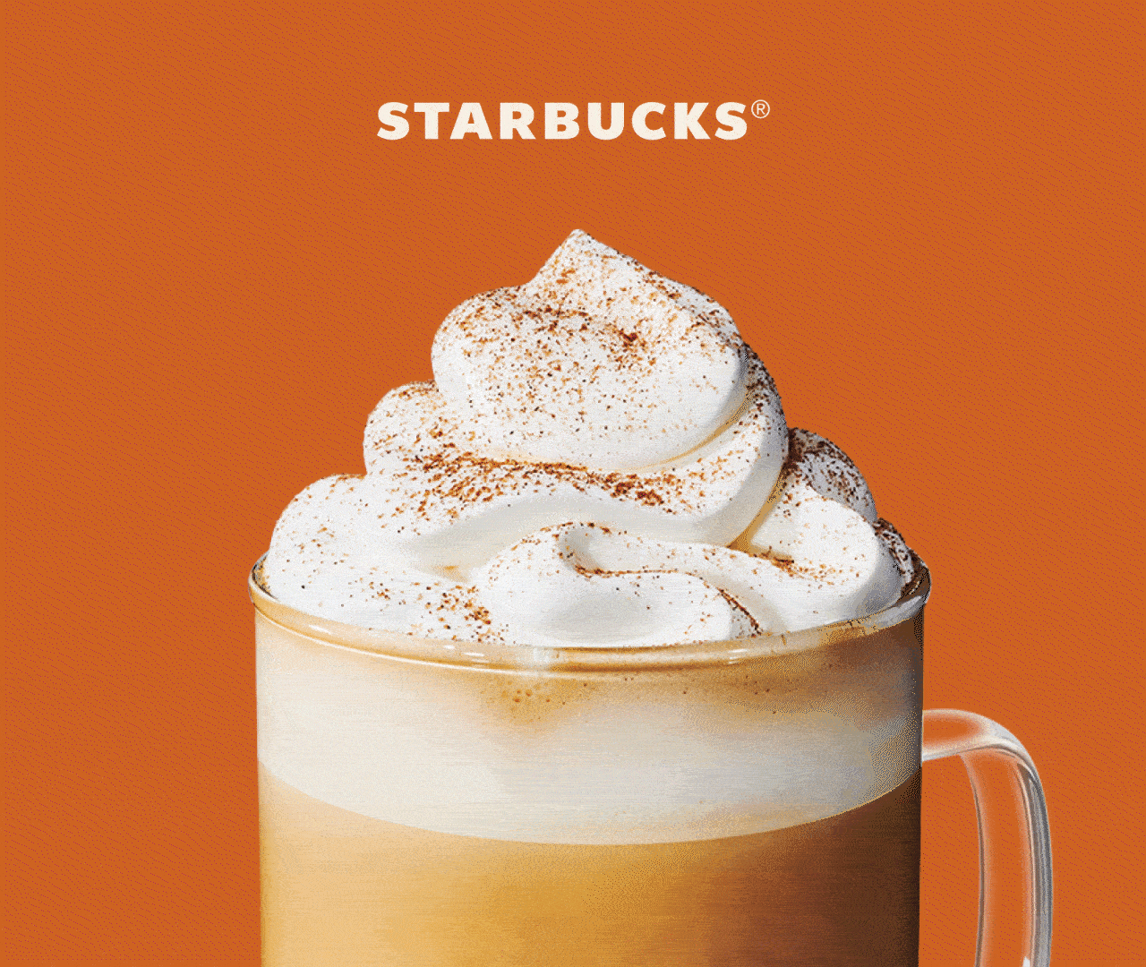 STARBUCKS® | A Pumpkin Spice Latte in a glass mug. Snow falls over the drink, covering it completely and then revealing a Peppermint Mocha.
