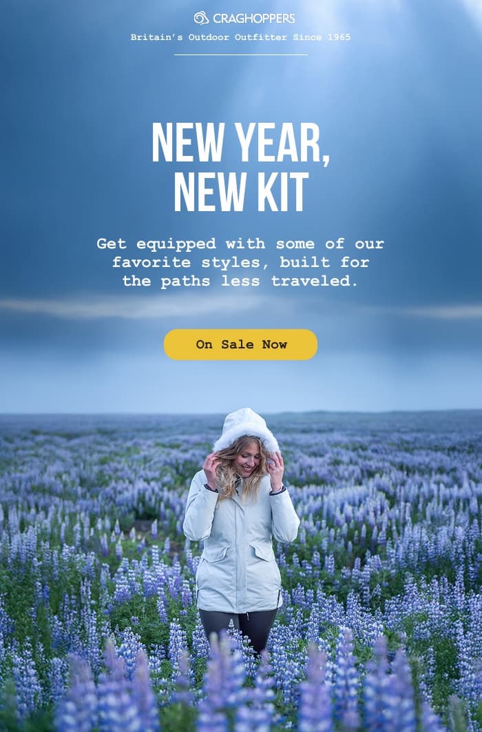 Picture of a woman wearing a winter parka in a field of Lupens. CTA: New year, new kit. On sale now.
