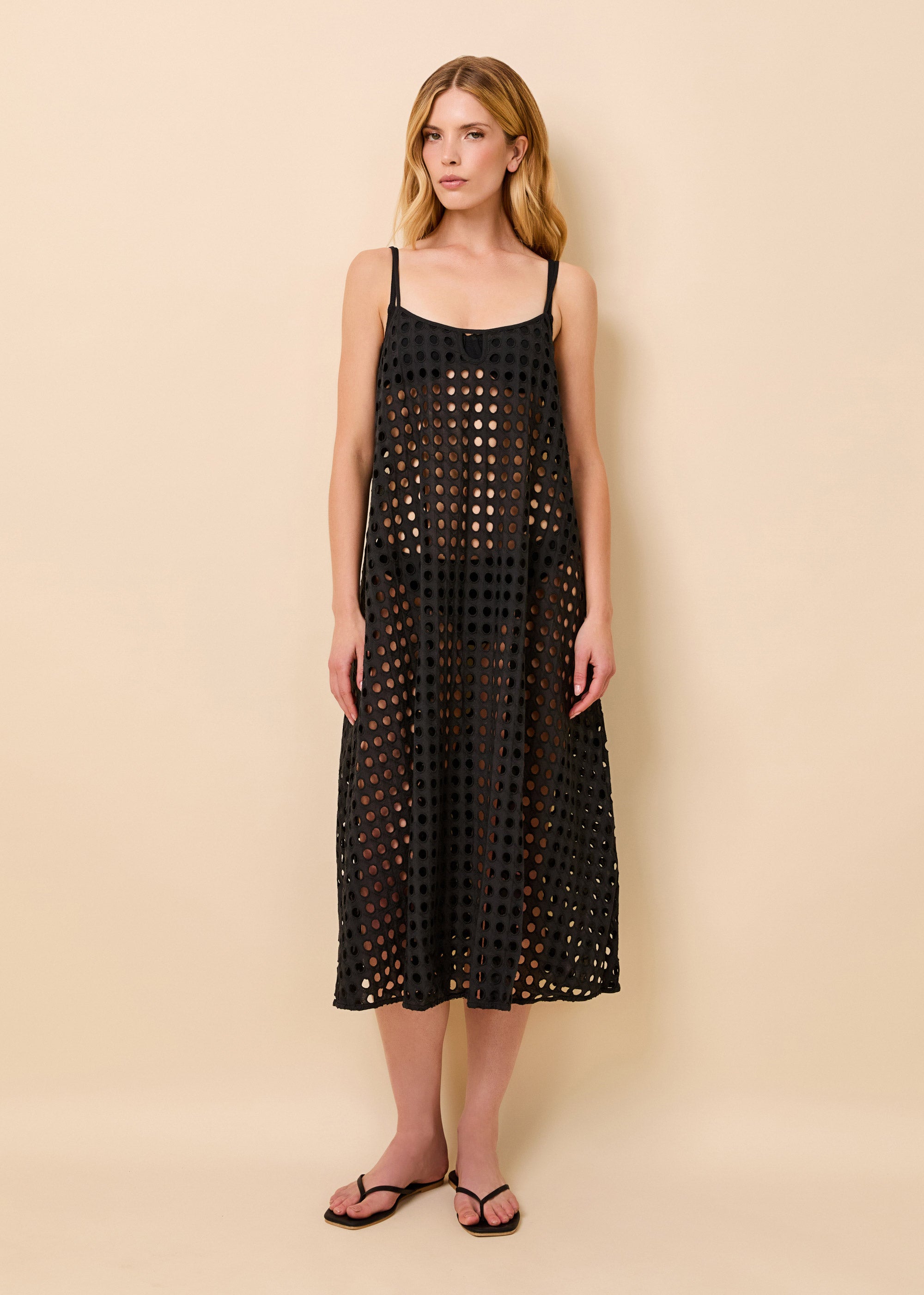 woman in black eyelet midi dress