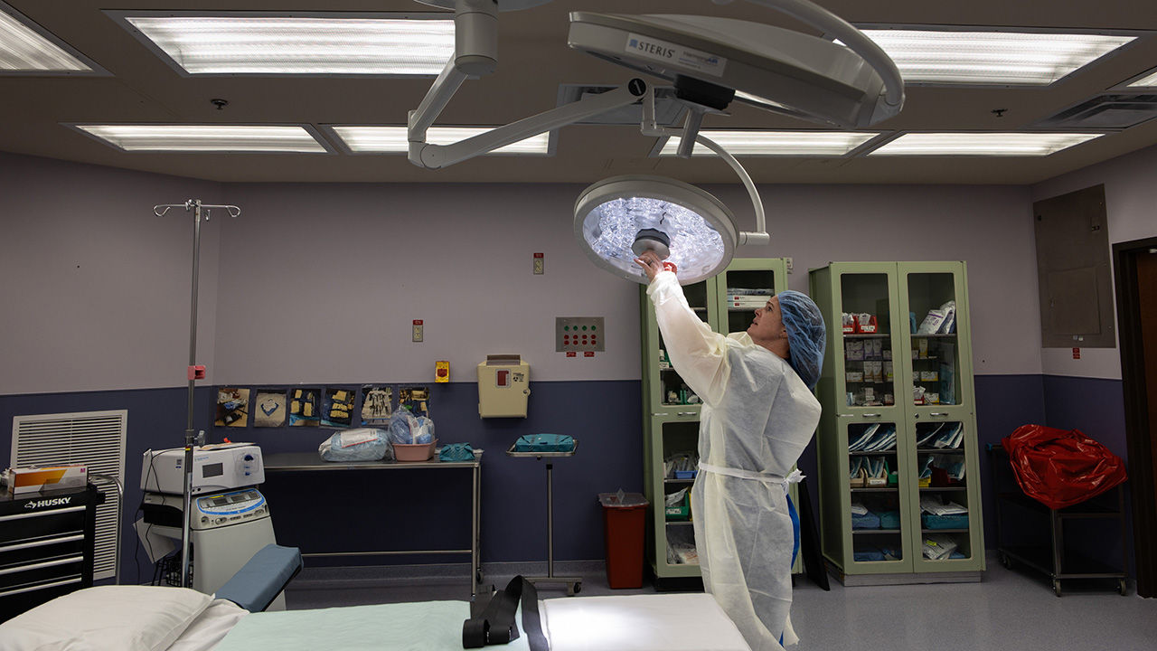 An operating light is turned on in the emergency operation room at the labour and delivery unit of a medical complex in Hondo, Texas