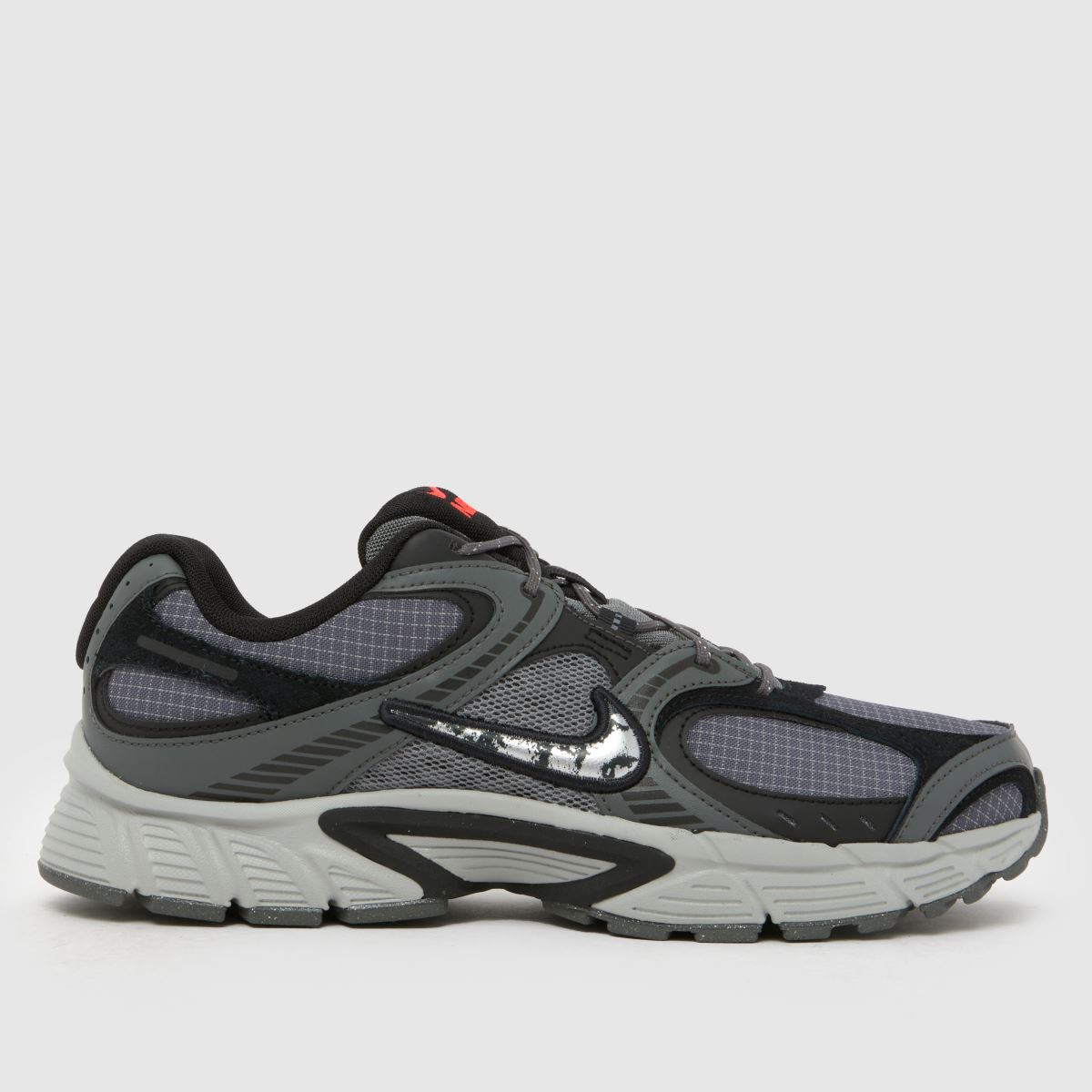 An image of a grey Nike trainer