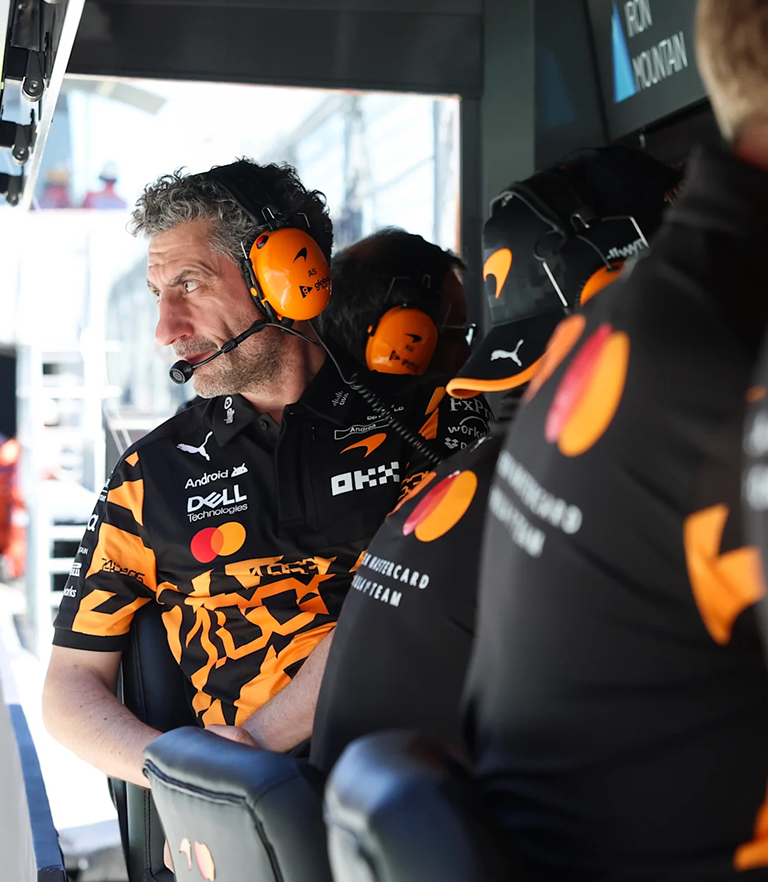 Who sits on McLaren' pit wall, and what do they do when they're there?