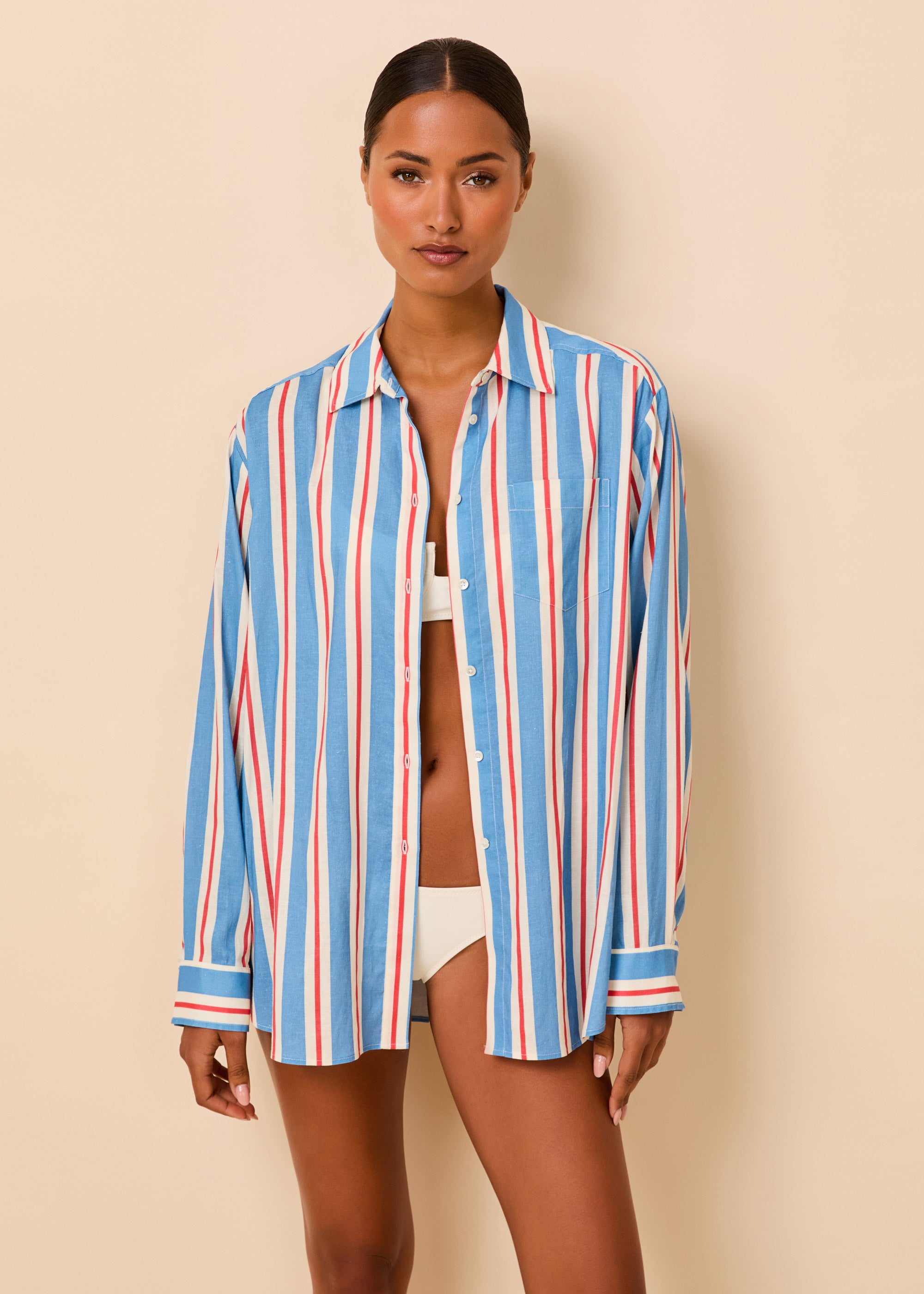 woman in a red white and blue stripped button down shirt