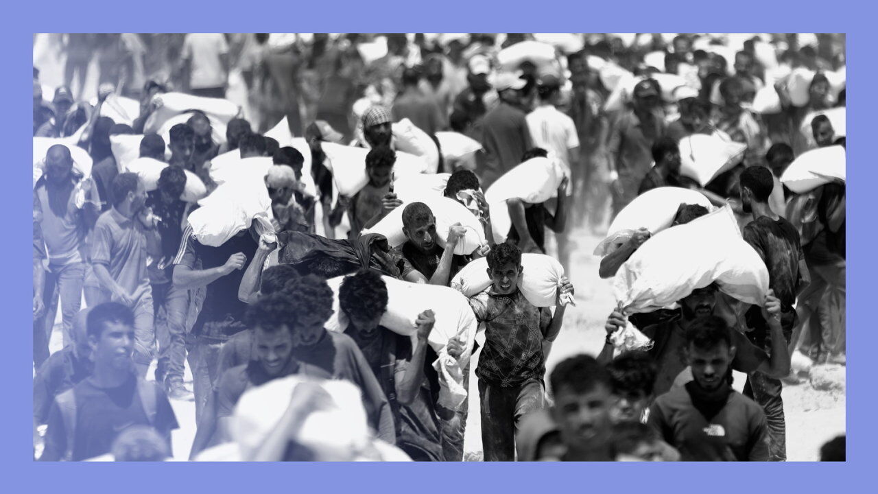 Palestinians walk for kilometers after receiving flour aid distributed from trucks that entered the Zikim area, a kibbutz in southern Israel, amid ongoing Israeli attacks and severe food shortages, in Gaza City