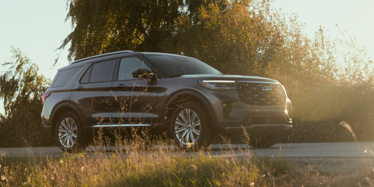 A black Ford Explorer® SUV with soft natural light reflecting off its grille