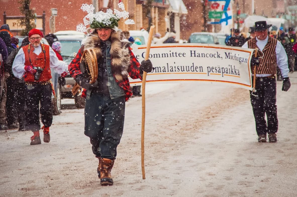 Adam Johnson (center) dresses up as Heikki Lunta.
