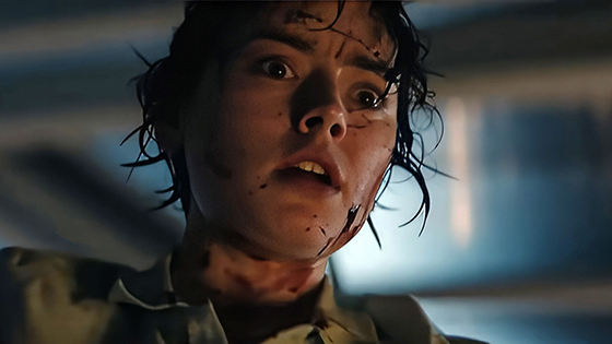 A frightened woman with blood on her face.