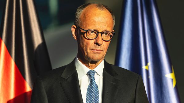 Friedrich Merz looking downcast.