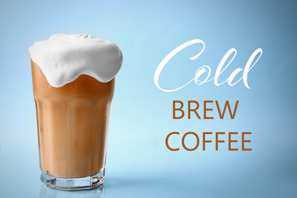 Glass of cold brew coffee with cold foam topping
