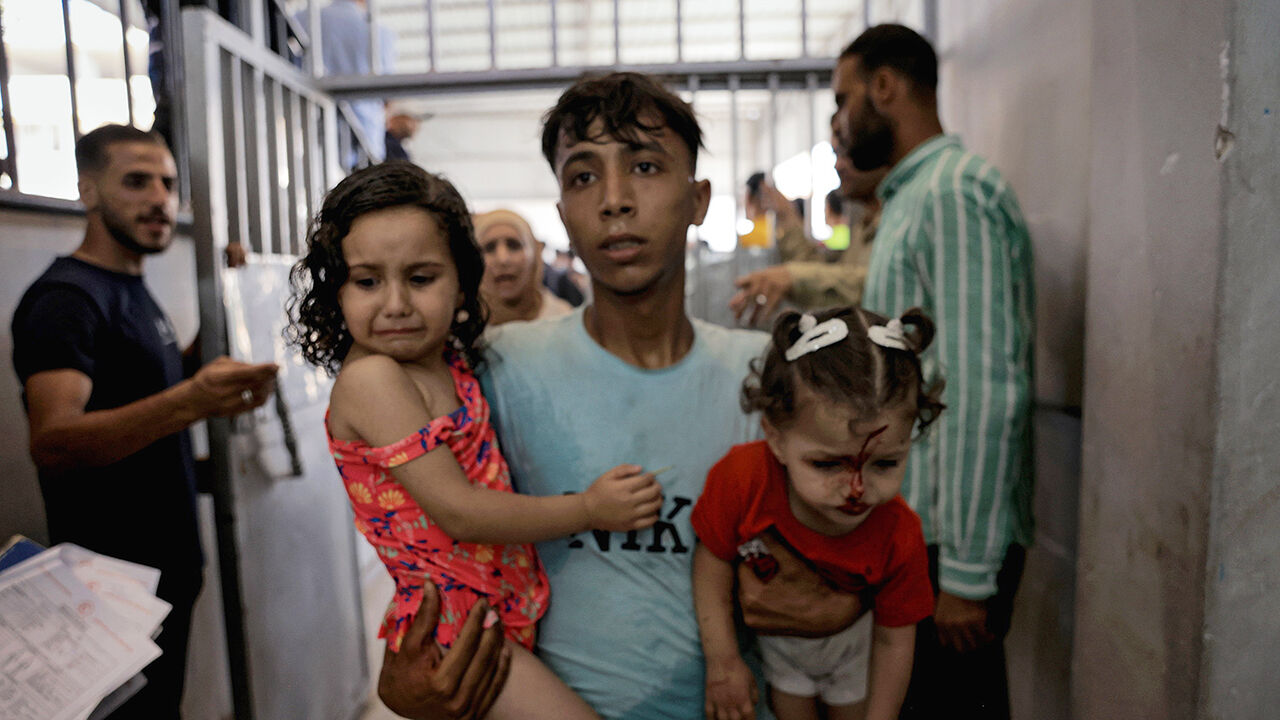 Bodies of Palestinians and wounded are brought to Al-Shifa Hospital following the Israeli warplanes targeted a cafe on the Gaza coast in Gaza City, Gaza