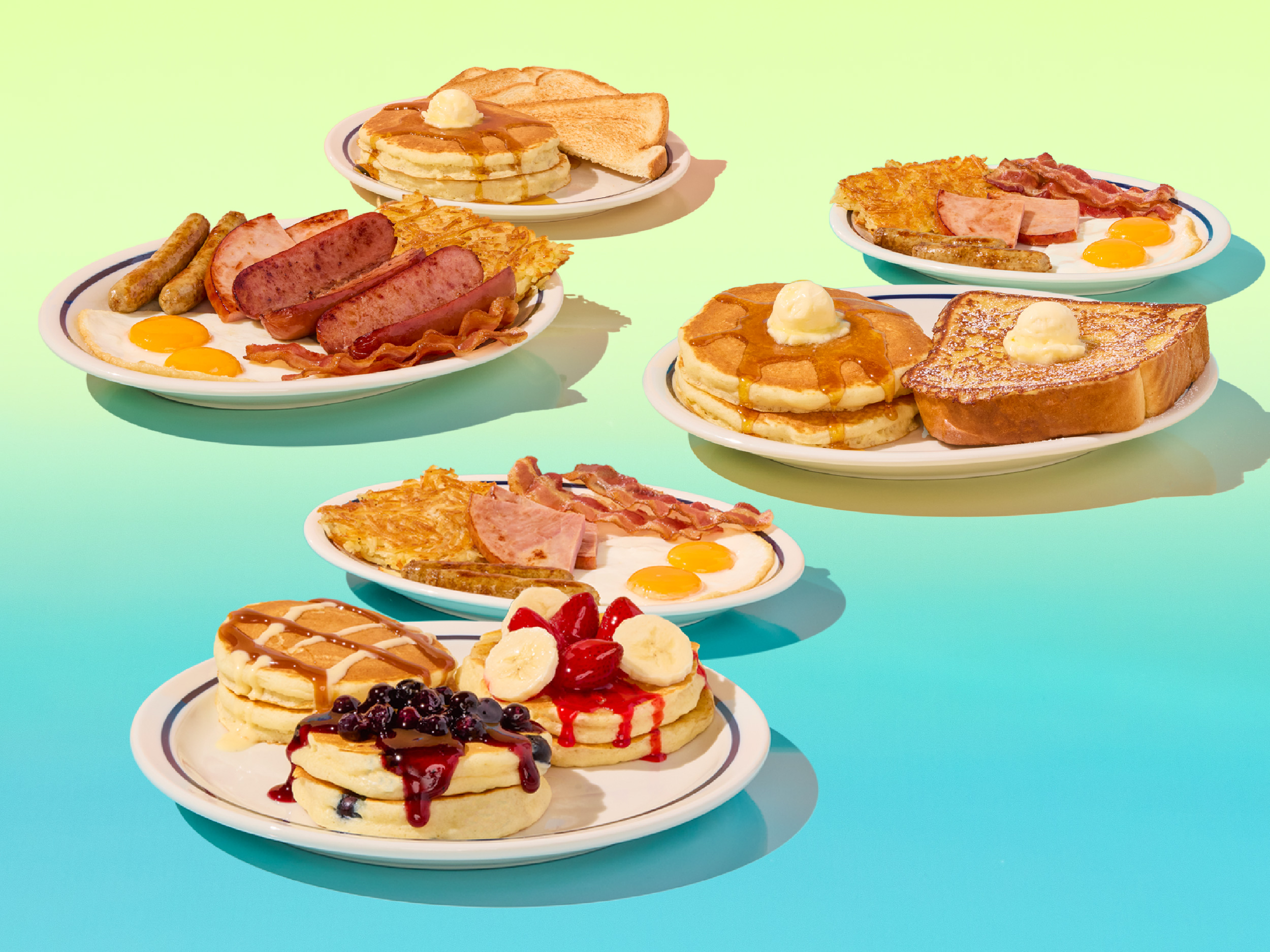 The Pancake Flight BreakFEAST, on a light blue to salmon gradient background