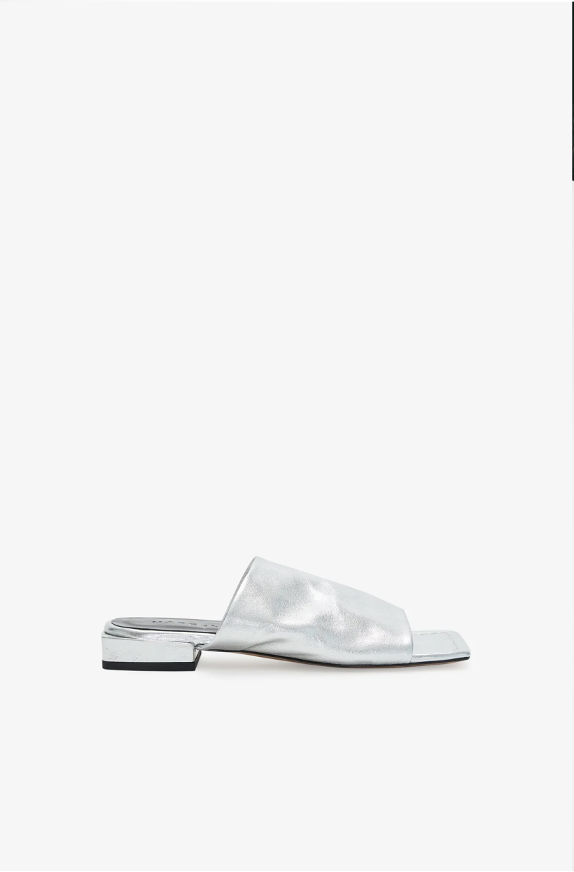 Side view of The Lisbet Sandals with a squared toe and flat sole on a white background.