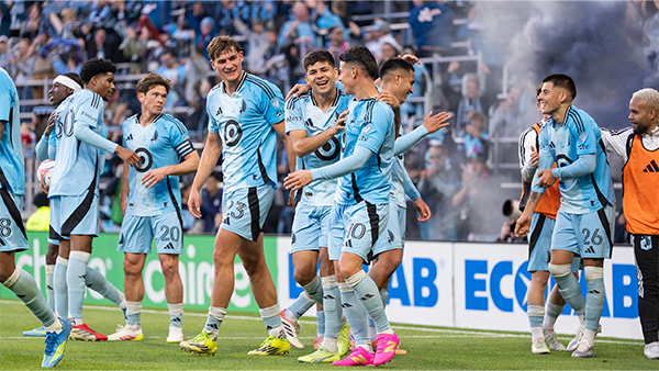 The squad celebrating a goal