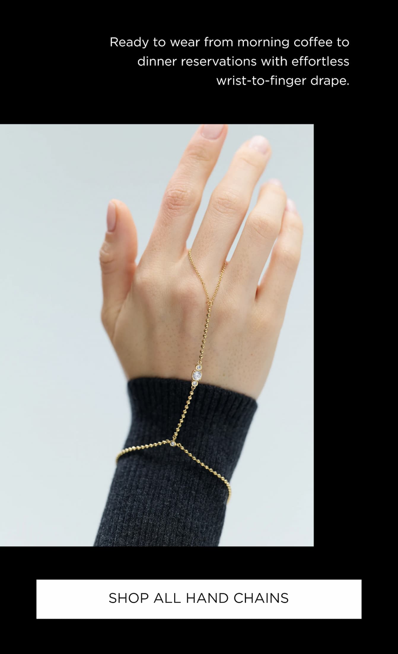 IMAGE OF MODEL'S HAND WEARING DELANCEY HAND CHAIN IN GOLD PLATING.
