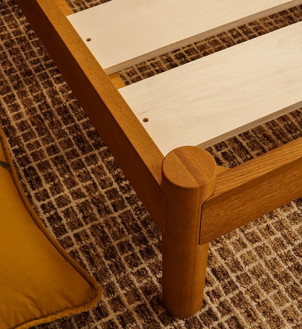 Built for Keeps close up of queen Architect bed frame in honey stain with durable joinery and wide slats