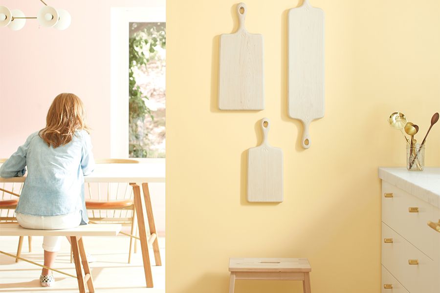 A room with yellow wall paint and decorations.