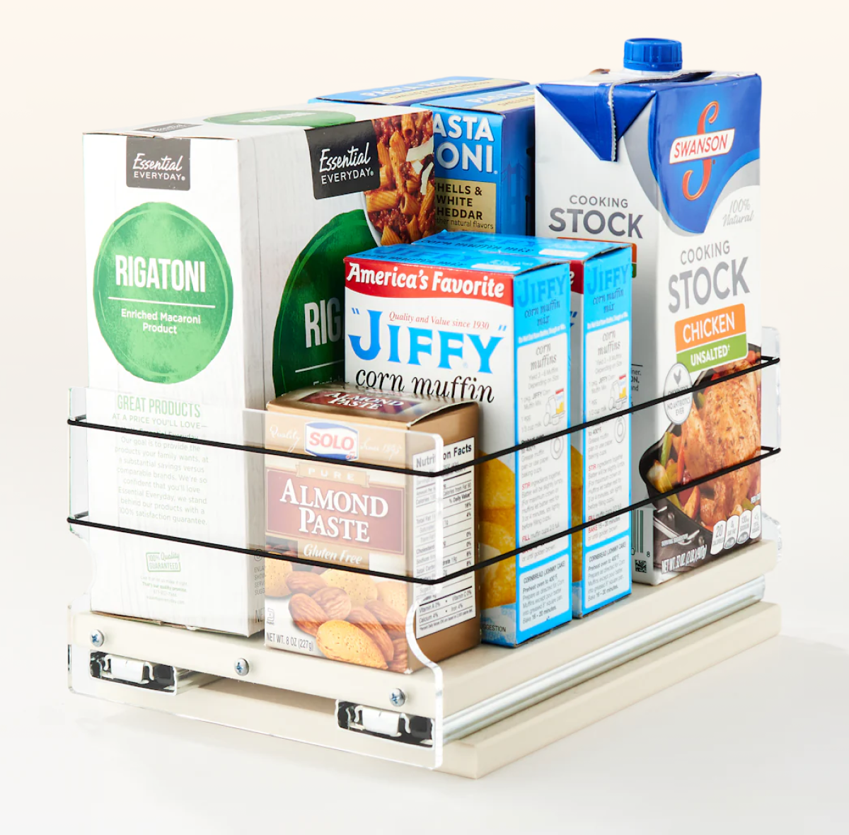 Pull-out cabinet organizer holding pantry boxes like pasta, muffin mix, and cooking stock for easy access