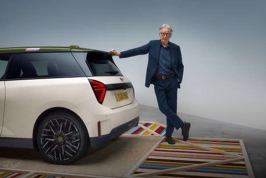 Paul Smith with arm against MINI and smiling
