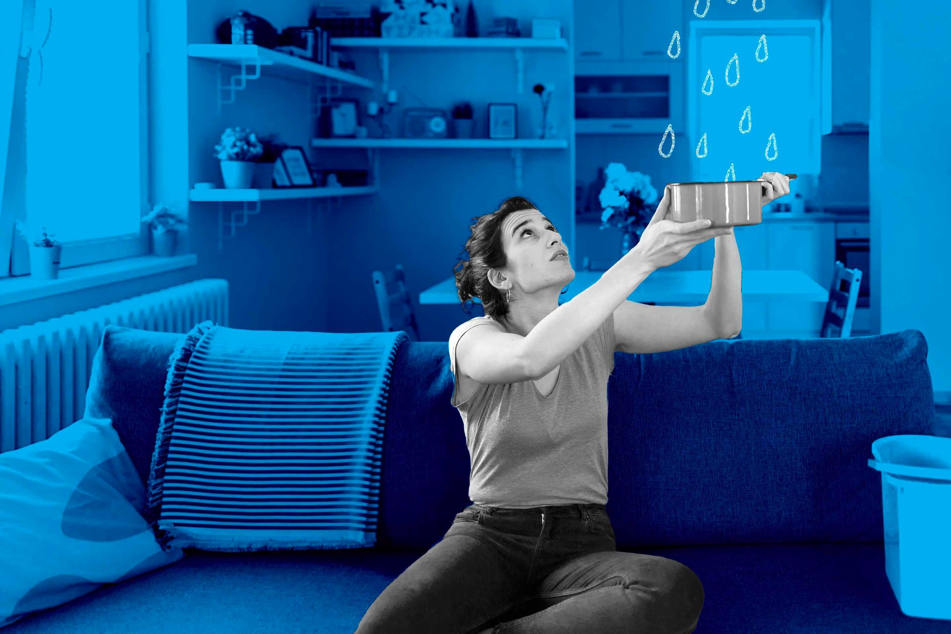 Woman holding up a bowl to catch drips while sitting on her couch