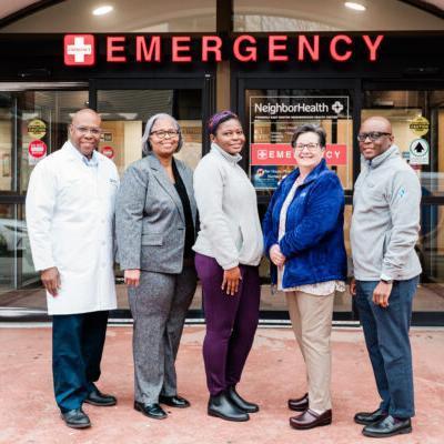 Outside of 10 Gove Street in East Boston, Dana-Farber and NeighborHealth clinical leaders gather on the day of the first cancer care clinic.