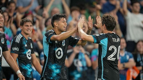 Anthony Markanich and Wil Trapp celebrate after a goal