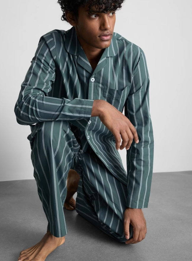 A man wearing a green and white pj