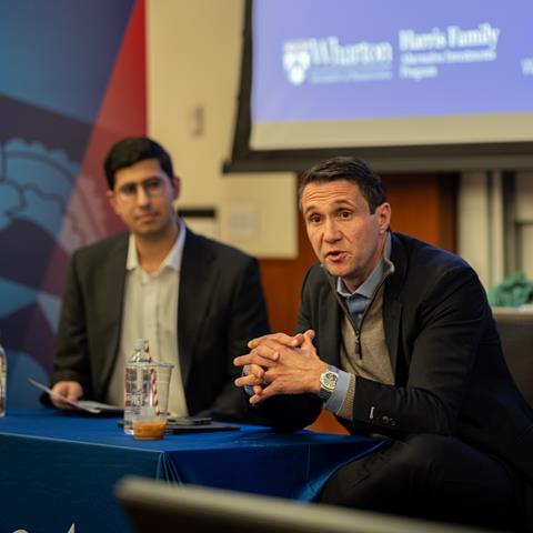 Two speakers engaged in a fireside chat