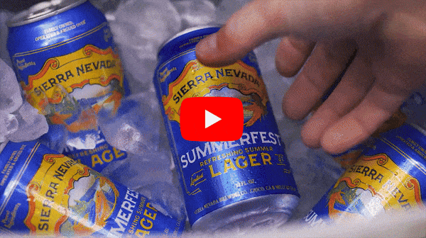Looping video: A hand grabbing a can of Summerfest from a cooler and cracking it open