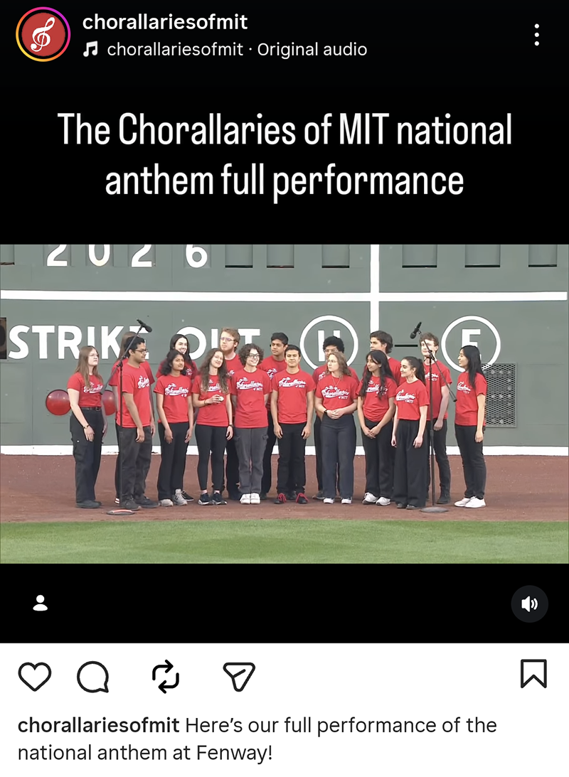 The Chorallaries of MIT, an a cappella group, sing together at Fenway Park in front of scoreboard with the text “The Chorallaries of MIT national anthem full performance.” Text via @‌chorallariesofmit: Here’s our full performance of the national anthem at Fenway!