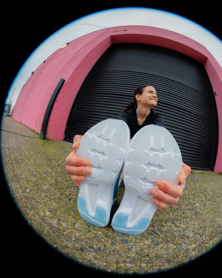 an image of a woman tying up her shoes