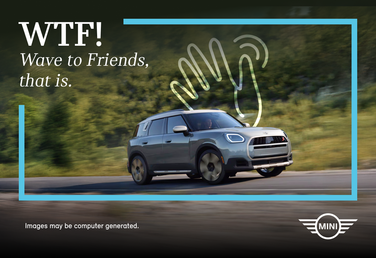 MINI driving on mountain road, hand icon waving.